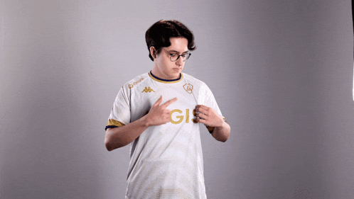 a man wearing a white shirt with the letters gis on it