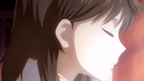 a close up of a girl 's ear with her eyes closed
