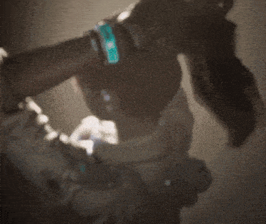 a blurred image of a person holding a pipe