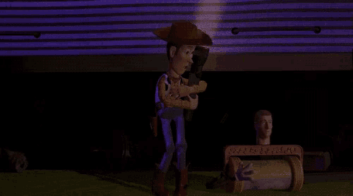 woody from toy story is holding a gun in his hands