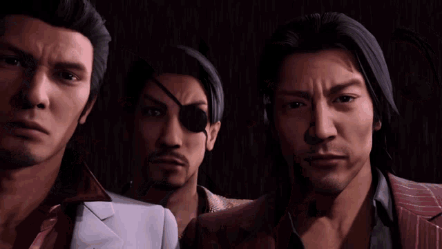 a group of men standing next to each other with one wearing a necklace