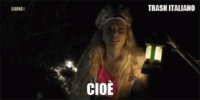 a woman is holding a lantern and says " cioe "