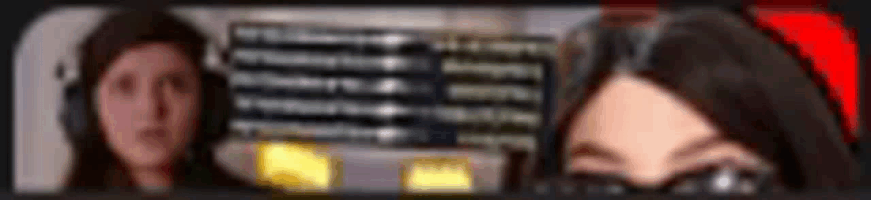 a blurry picture of two women standing next to each other . one of the women is wearing glasses .
