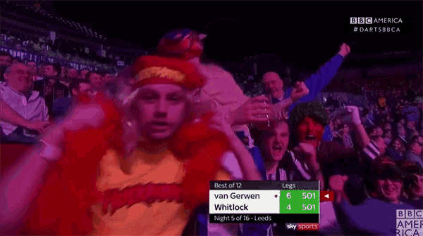 a crowd of people watching a game between van gerwen and whitlock on a bbc america channel