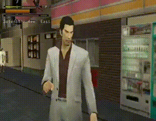 a man in a suit stands in front of a vending machine