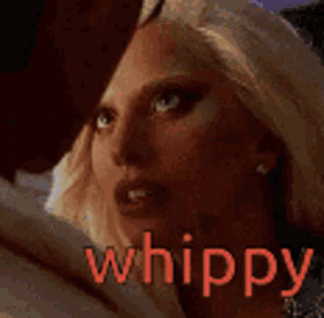 a close up of a woman 's face with the words whippy written on it .