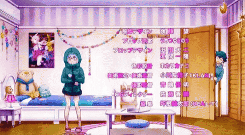 a girl in a blue hoodie is standing in a room with chinese writing