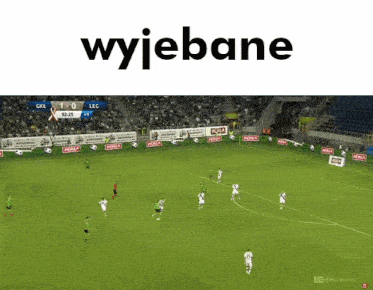 a soccer game is being played in a stadium and the score is 1-0