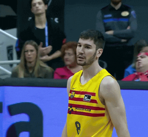 a basketball player wearing a yellow and red jersey with the number 9 on it