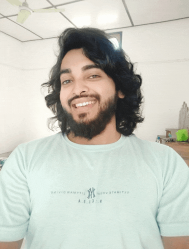 a man with long hair and a beard wears a shirt that says ny on it