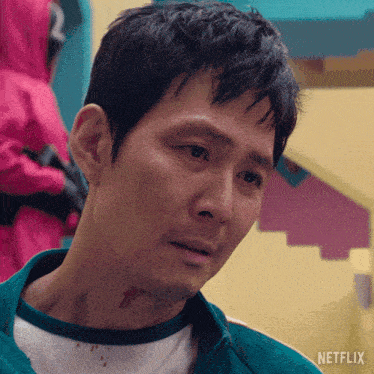 a close up of a man 's face with the word netflix on the bottom right