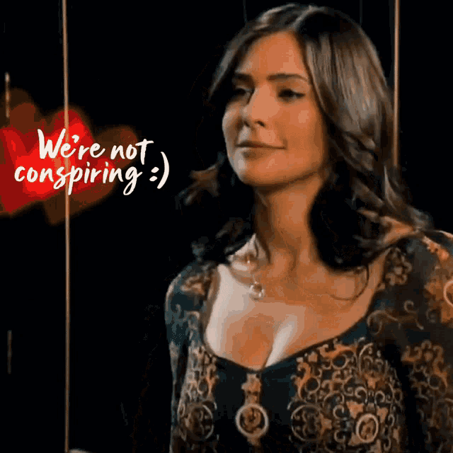 a woman with the words we 're not conspiring written above her
