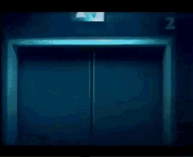 a nurse is standing in a hallway with the number 2 behind her