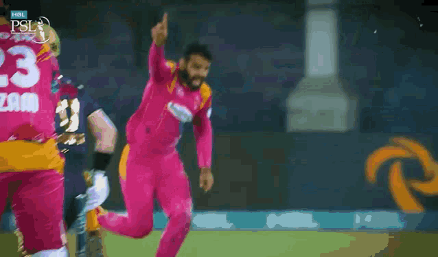 a man in a pink uniform with the number 23 on it