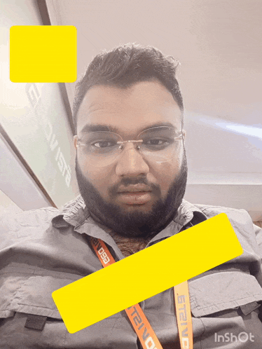 a man wearing glasses and a lanyard that says teva on it