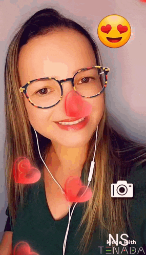a woman wearing glasses and a clown nose takes a picture