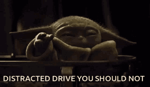 a picture of a baby yoda with the words " distracted drive you should not "