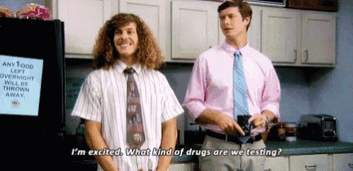 two men standing in a kitchen with one saying i 'm excited what kind of drugs are we testing ?