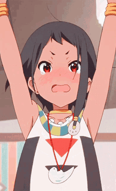 a girl with a necklace around her neck has her arms up in the air