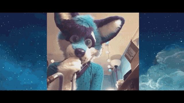 a purple and white furry animal with a hose in its mouth