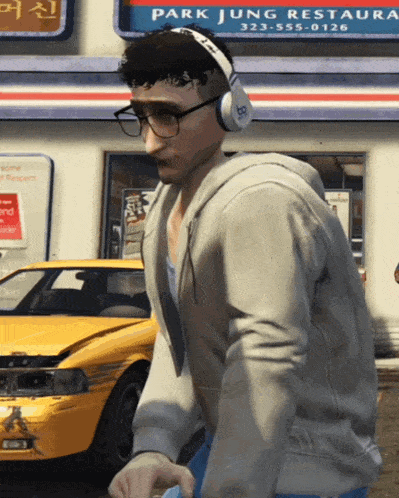 a man wearing headphones is standing in front of park jung restaurant