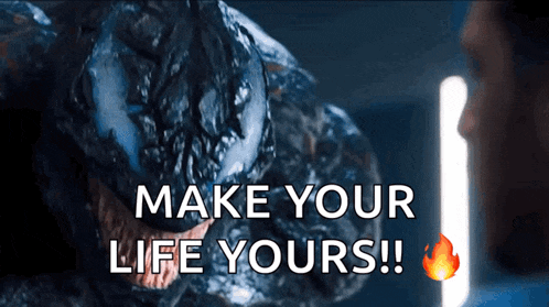 a man is looking at a monster with the words make your life yours written on it