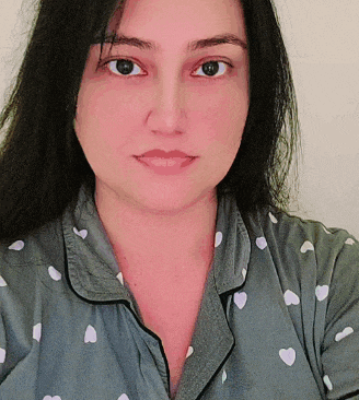 a woman wearing a polka dot shirt with white hearts on it