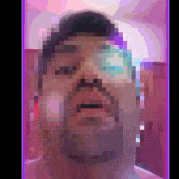 a pixelated picture of a man with a beard