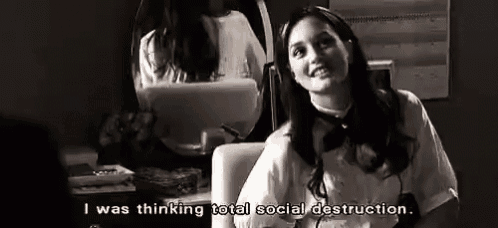 a black and white photo of a woman sitting in front of a mirror with the words `` i was thinking total social destruction . ''