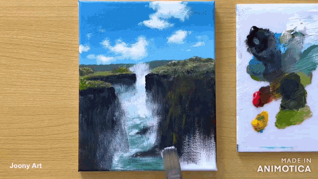 a painting of a waterfall is being painted on a canvas by joony art