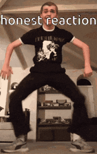 a man in a black shirt is dancing in front of a sign that says honest reaction .