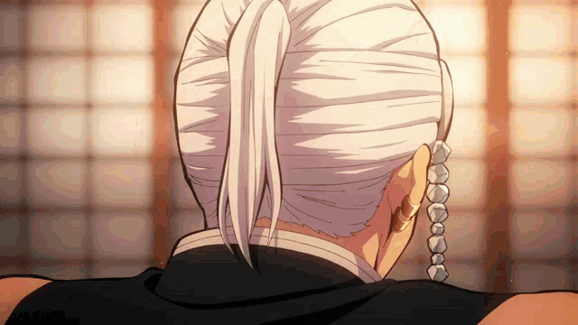 a close up of a person 's head with white hair