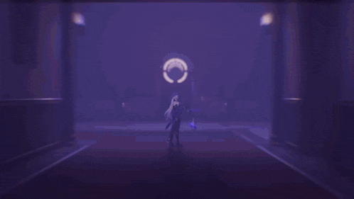 a purple light is shining on a person in a dark room
