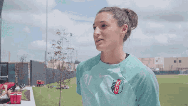 a female soccer player wearing a number 31 jersey