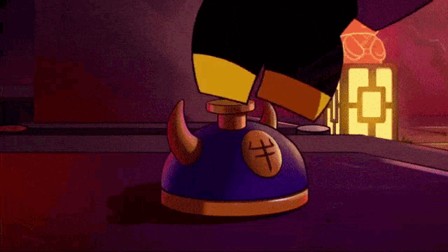 a cartoon character 's foot is pressing a button that has a cross on it