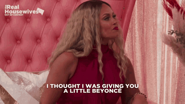 a woman in a red dress says " i thought i was giving you a little beyoncé "