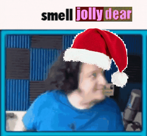 a picture of a person wearing a santa hat with the words smell jolly dear above it