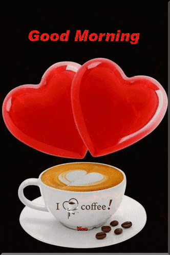 a cup of coffee with two red hearts on top and the words good morning