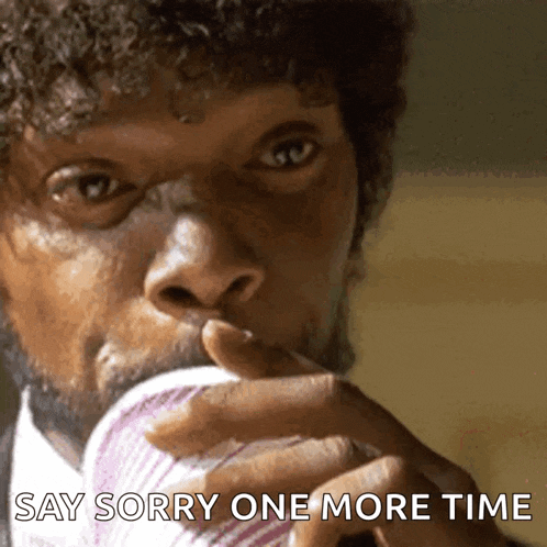 a man with curly hair is drinking from a cup with the words say sorry one more time below him