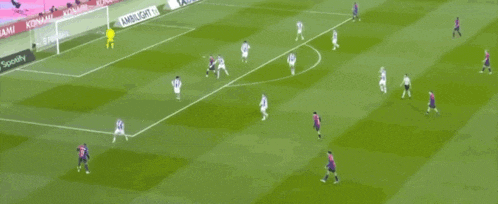 a soccer game is being played on a field sponsored by spotify