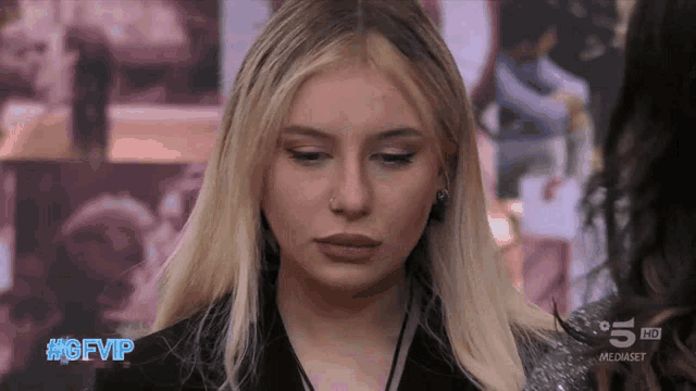 a woman with a nose ring looks at the camera with the hashtag #gfvip