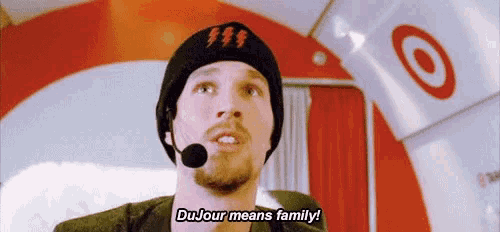 a man wearing a beanie and a microphone is talking about dujour means family .