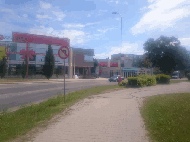 a no left turn sign is on the side of a street