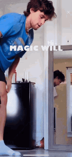 a man in a blue shirt stands in front of a door with the words magic will written on it