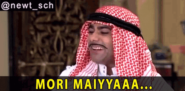 a man in a keffiyeh with the words mori maiyyaaa written below him