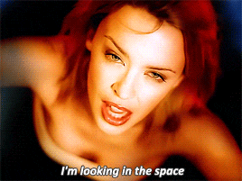 a close up of a woman 's face with the words i 'm looking in the space below her