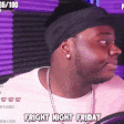 a man wearing a headband and a pink shirt says fright night friday .