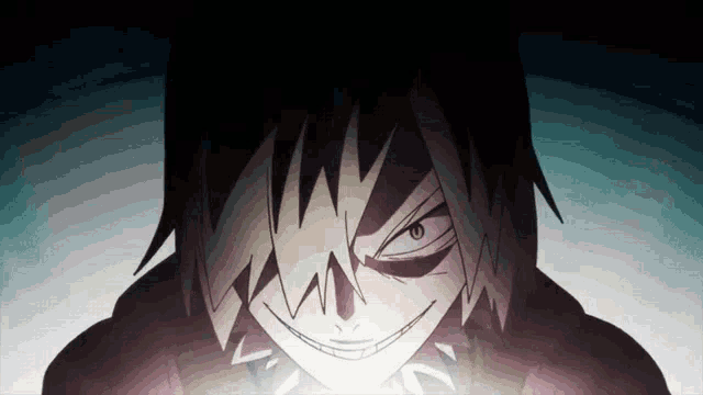 a close up of a person 's face with a smirk on it