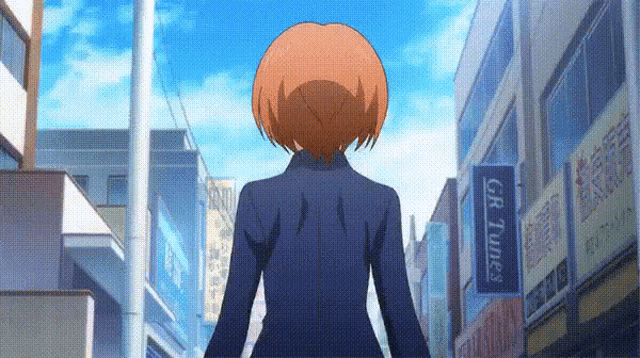 a girl with red hair is walking down a street with a gr times sign in the background