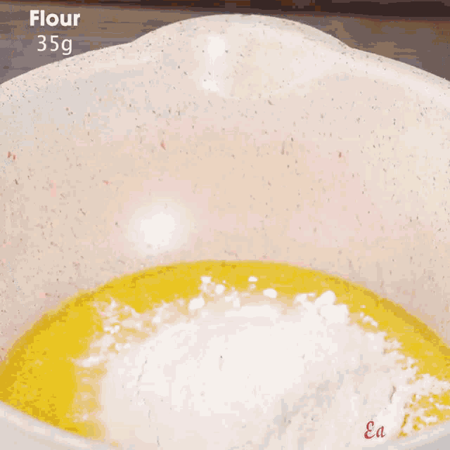 a person is stirring a brown substance in a pot with easy plus written on the bottom